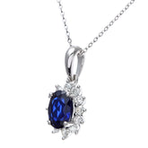 1.1ct Oval Sapphire and 0.25ct Diamond Cluster Pendant in UK Hallmarked 9ct White Gold